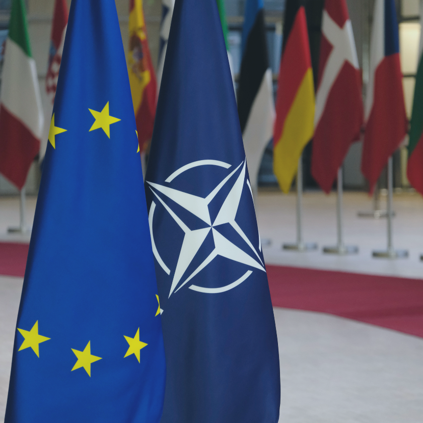 Flag of European Union and flag of NATO in European Councils Building on February 26, 2021