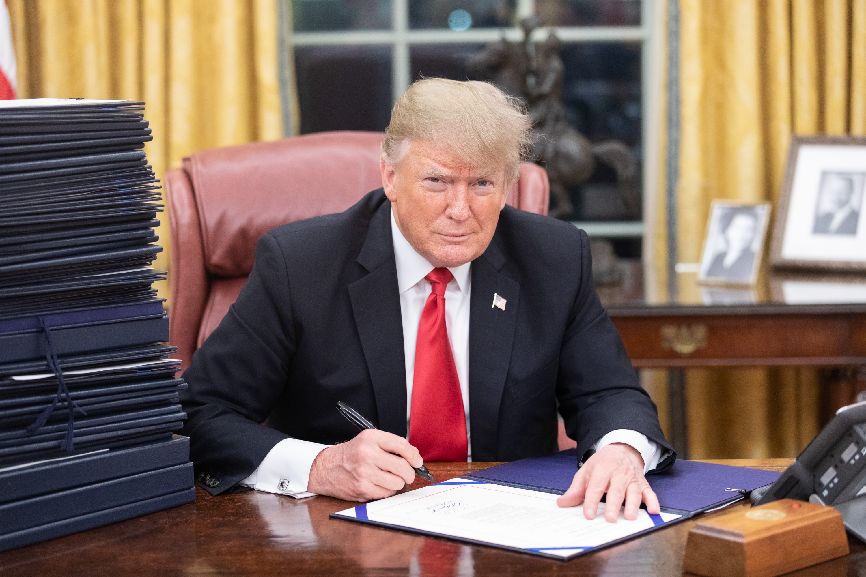 President Donald Trump signing executive orders on December 21, 2018, the day before the 2018–2019 government shutdown.