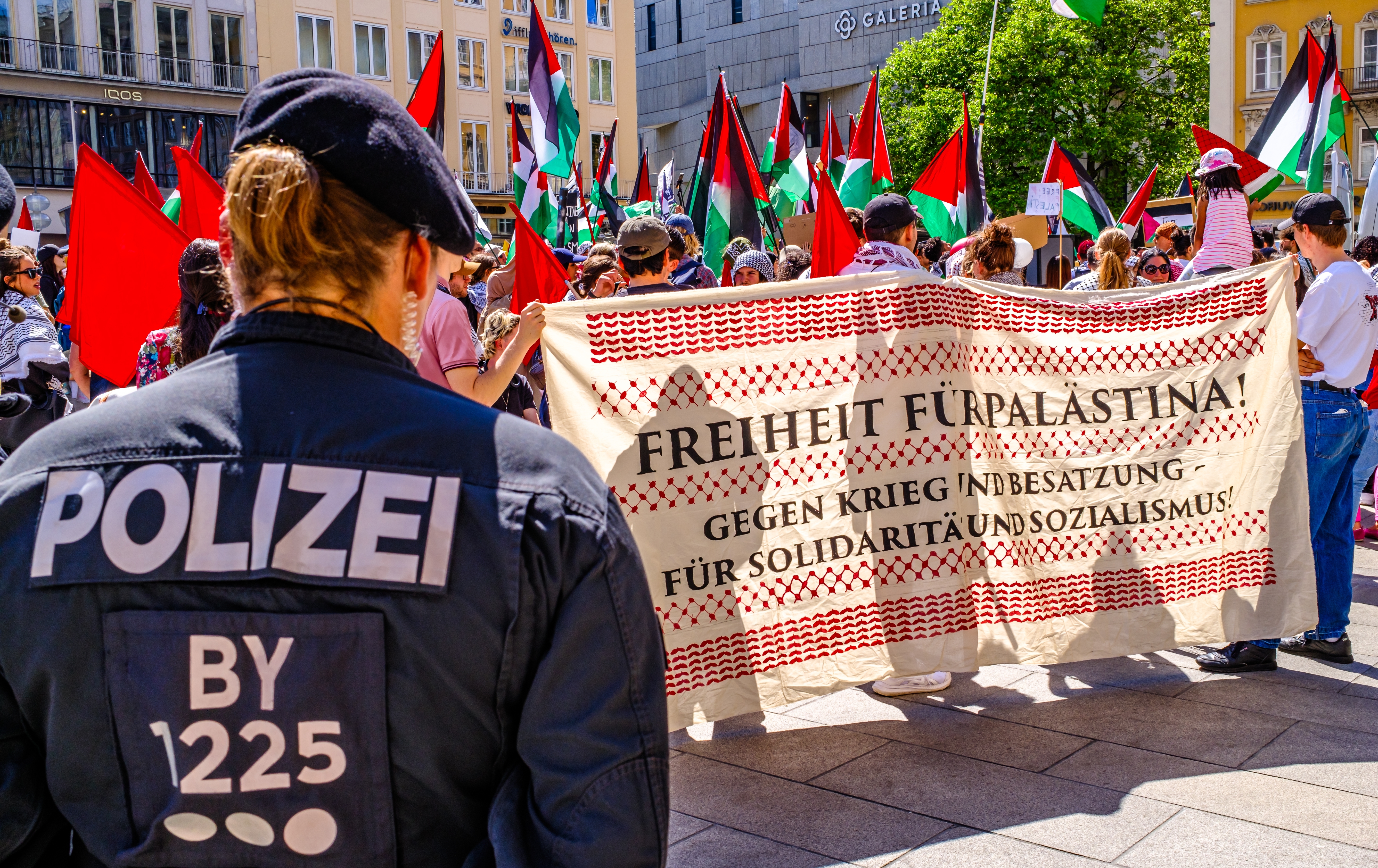 Munich, Germany - May 18, 2024: Protest banners and activists at a demonstration for peace in Gaza