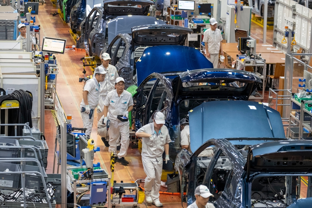 An electric vehicle production assembly line is seen at the GAC Aion smart eco-factory in Guangzhou, Guangdong,