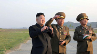 photo-d-archive-transmise-le-21-avril-2014-par-l-agence-kcna-via-kns-du-dirigeant-nord-coreen-kim-jong-un-assistant-a-un-entrainement-d-une-unite-de-l-armee-de-l-air-quelque-part-en-coree-du-nord_5400829.jpg
