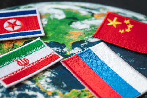 Flags of Iran, Russia, China and North Korea.