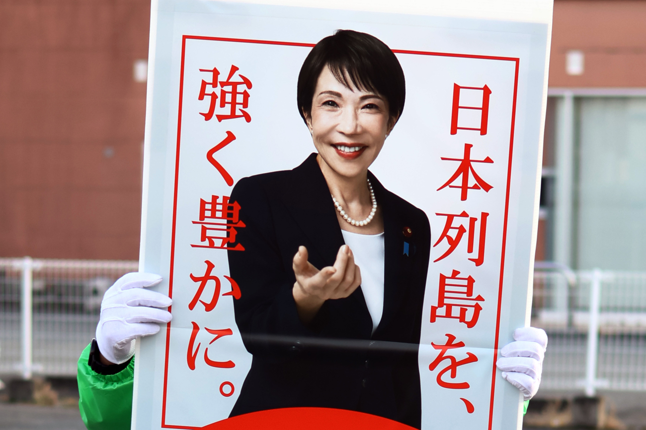 House of Representatives election in Tokyo,Japan - 8 FEB 2026. Liberal Democratic Party supporter seen holding a poster of Party President Sanae Takaichi in Ginza