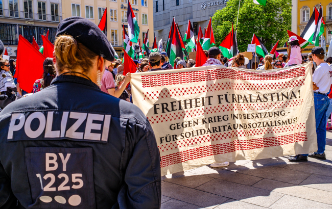 Munich, Germany - May 18, 2024: Protest banners and activists at a demonstration for peace in Gaza