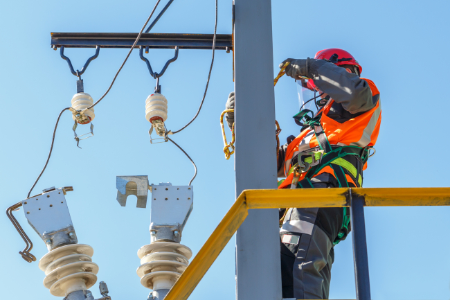 electrician working with high voltage electrical equipment