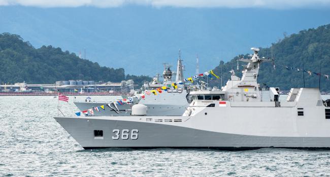PADANG, INDONESIA - APRIL 11, 2016 : KRI Sultan Hasanuddin (366), Sigma class corvette of Indonesian Navy anchors among the other navies participating in Multilateral Naval Exercise Komodo 2016.