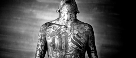 Chelatenango, El Salvador. May 2007. A member of the Mara Salvatrucha gang displays his tattoos inside the Chelatenango prison.