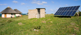 Solar panels providing power to a village in Africa. Shutterstock/Daleen Loest