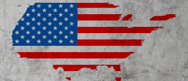 US map on dirty grunge cement background ©Vladimir Arndt/Shutterstock
