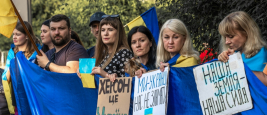 Sofia, Bulgaria, June 13, 2022: people holding Ukrainian flag and banners supporting Ukraine.