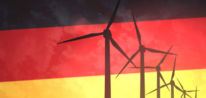 Wind turbines on the background of the flag of Germany