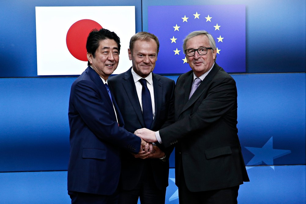Japan's Prime minister Shinzo Abe is welcomed by EU Council President Donald Tusk and EU Commission President Jean-Claude Juncker at the EU Japan leader's summit meeting in Brussels on 6 July 2017
